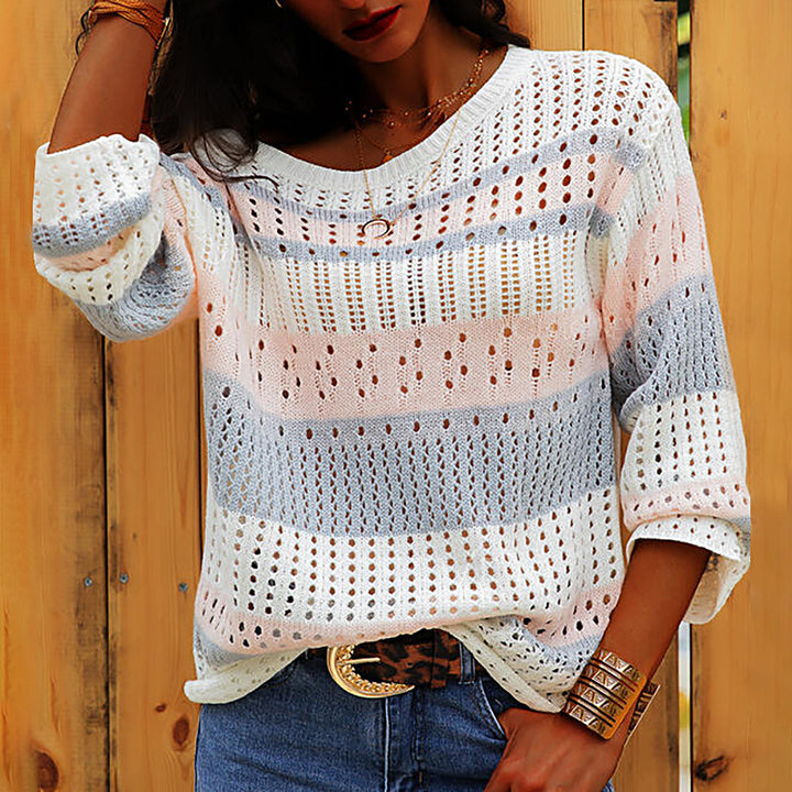 Pink loose striped knit sweater on model