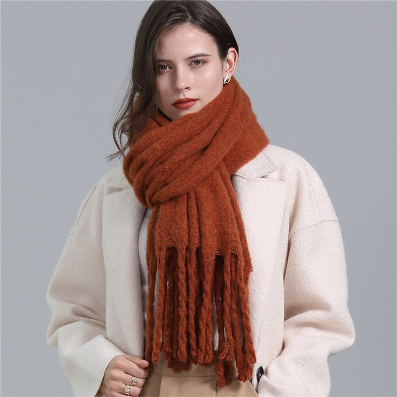 Women's long solid color winter scarf with tassel ends