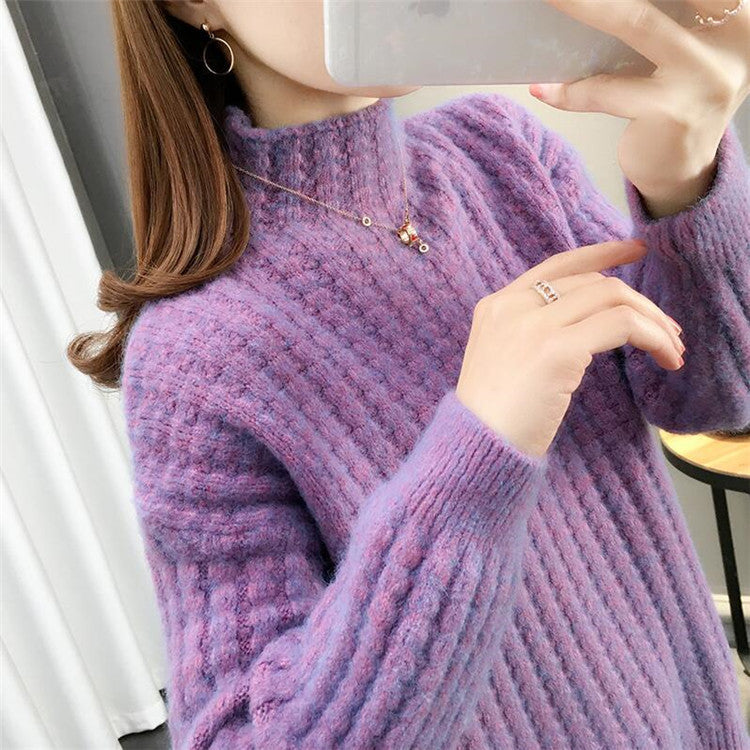 Women's cable knit turtleneck sweater front view