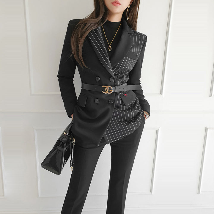 Woman wearing black striped blazer and slim pants set