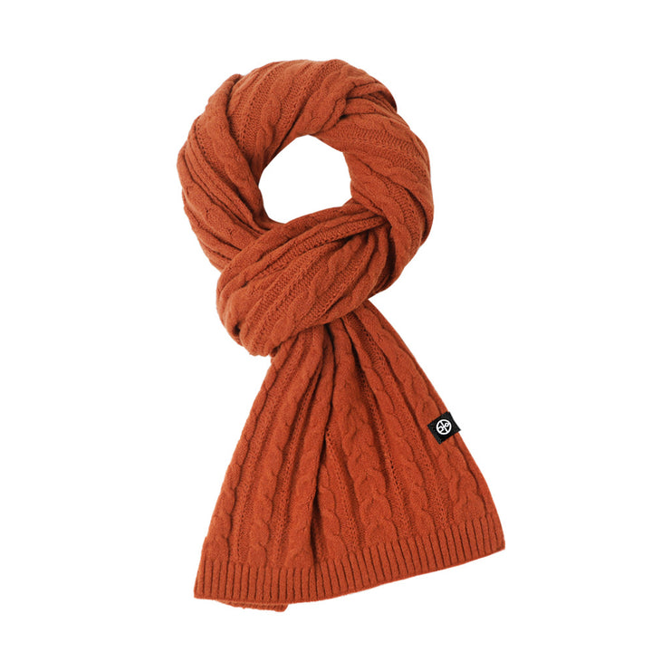 Woman wearing solid color long winter scarf outdoors