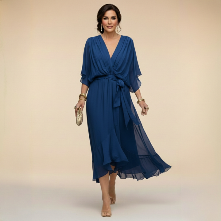 Woman wearing flowy V-neck dress outdoors