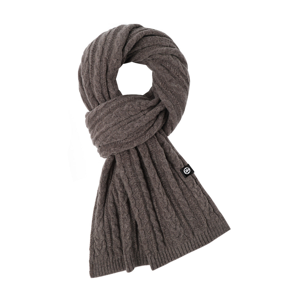 Woman wearing solid color long winter scarf outdoors