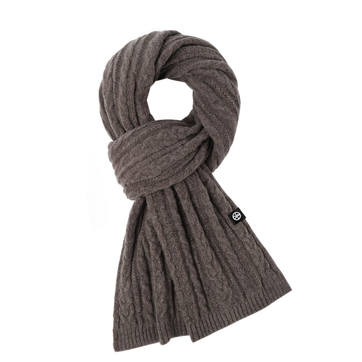 Woman wearing solid color long winter scarf outdoors