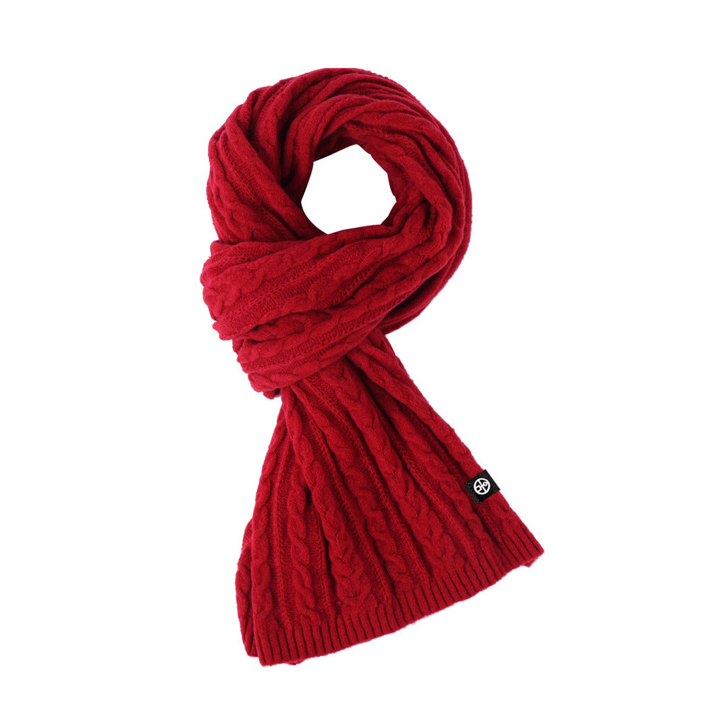 Woman wearing solid color long winter scarf outdoors