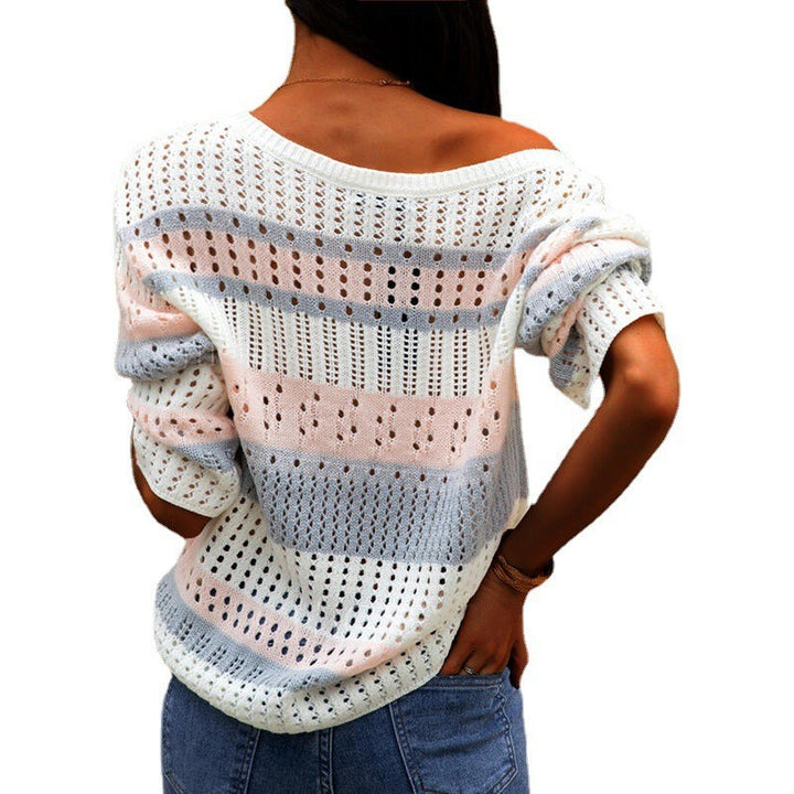 Pink loose striped knit sweater on model
