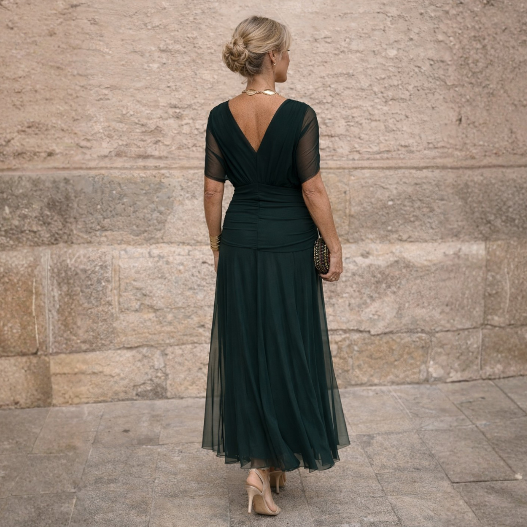 Woman wearing long maxi dress with crossover V-neck