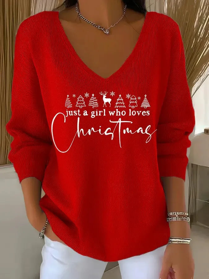 Woman wearing festive V-neck Christmas sweater with holiday print
