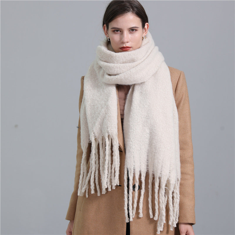 Women's long solid color winter scarf with tassel ends