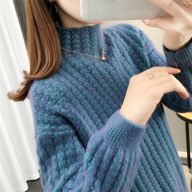 Women's cable knit turtleneck sweater front view