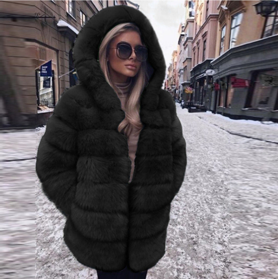 Woman wearing a faux fur winter coat with fur collar