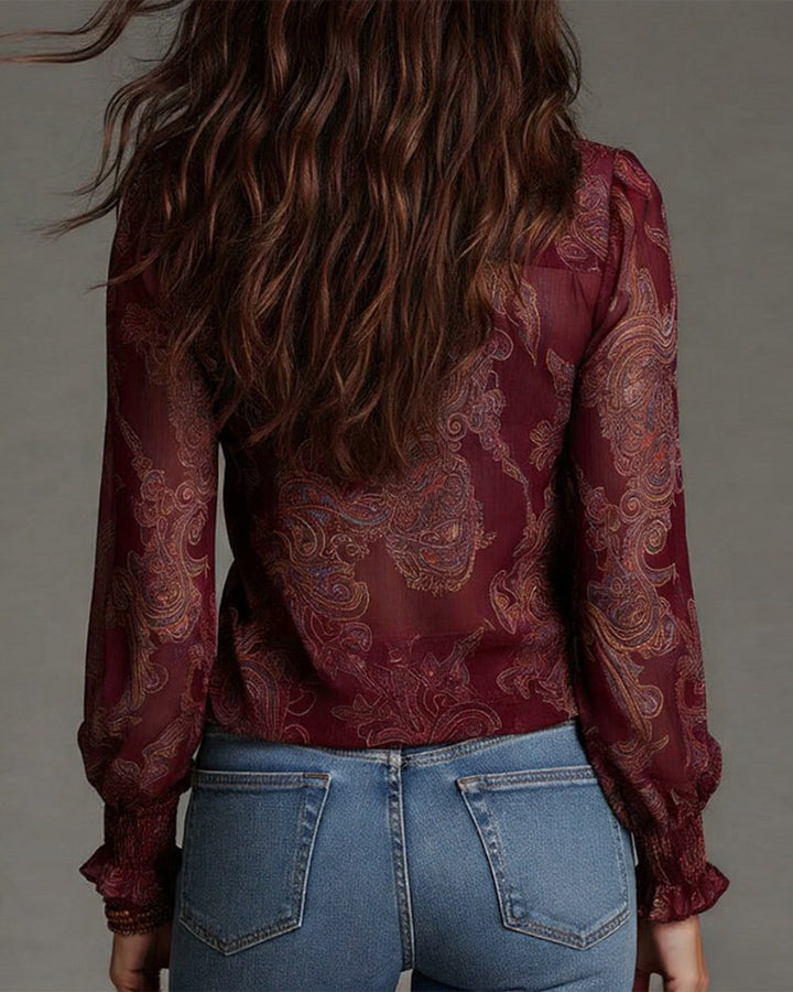 Woman wearing ruffle sleeve V-neck blouse with zip