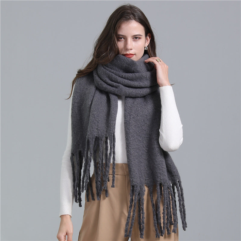 Women's long solid color winter scarf with tassel ends