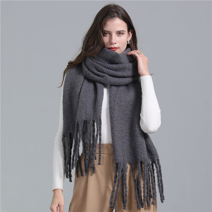 Women's long solid color winter scarf with tassel ends