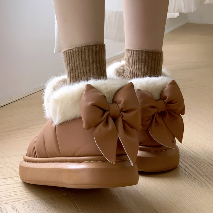 Women's winter ankle boots with thick sole and bow detail