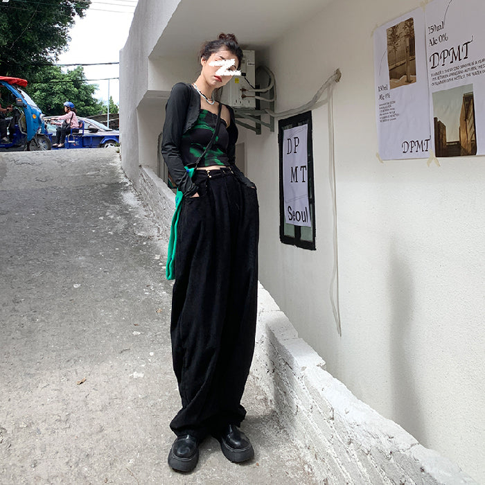 Woman wearing high waist wide leg pants in black