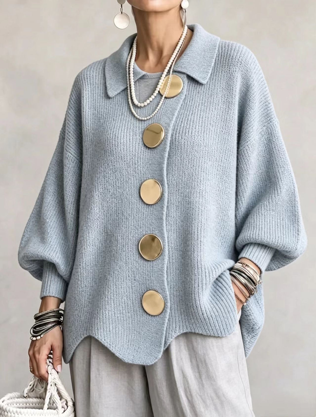 Woman wearing oversized cardigan with lantern sleeves