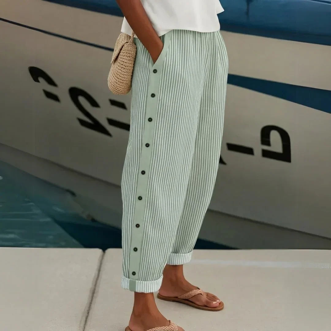 Woman wearing striped high-waisted button pants