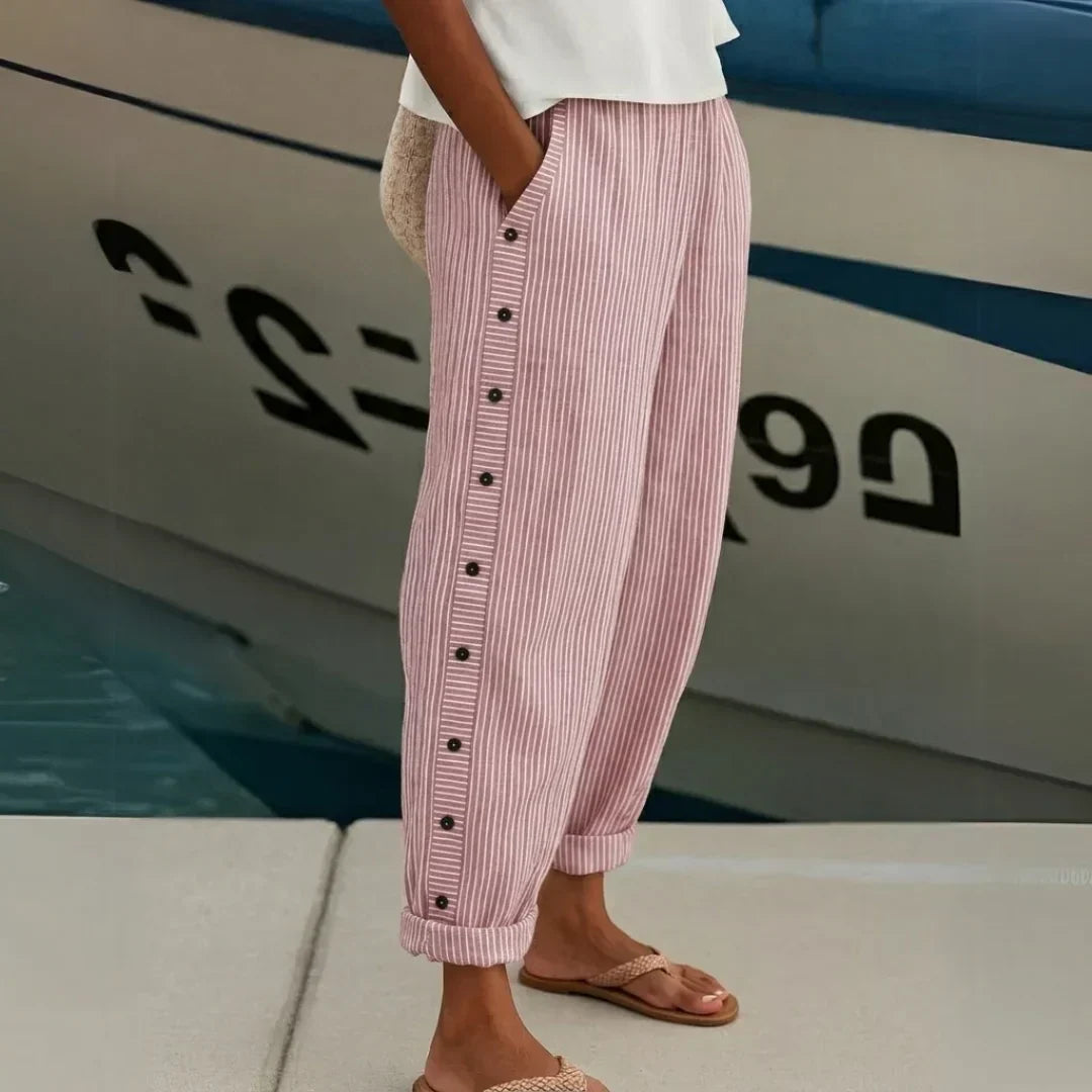 Woman wearing striped high-waisted button pants