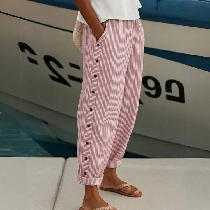 Woman wearing striped high-waisted button pants
