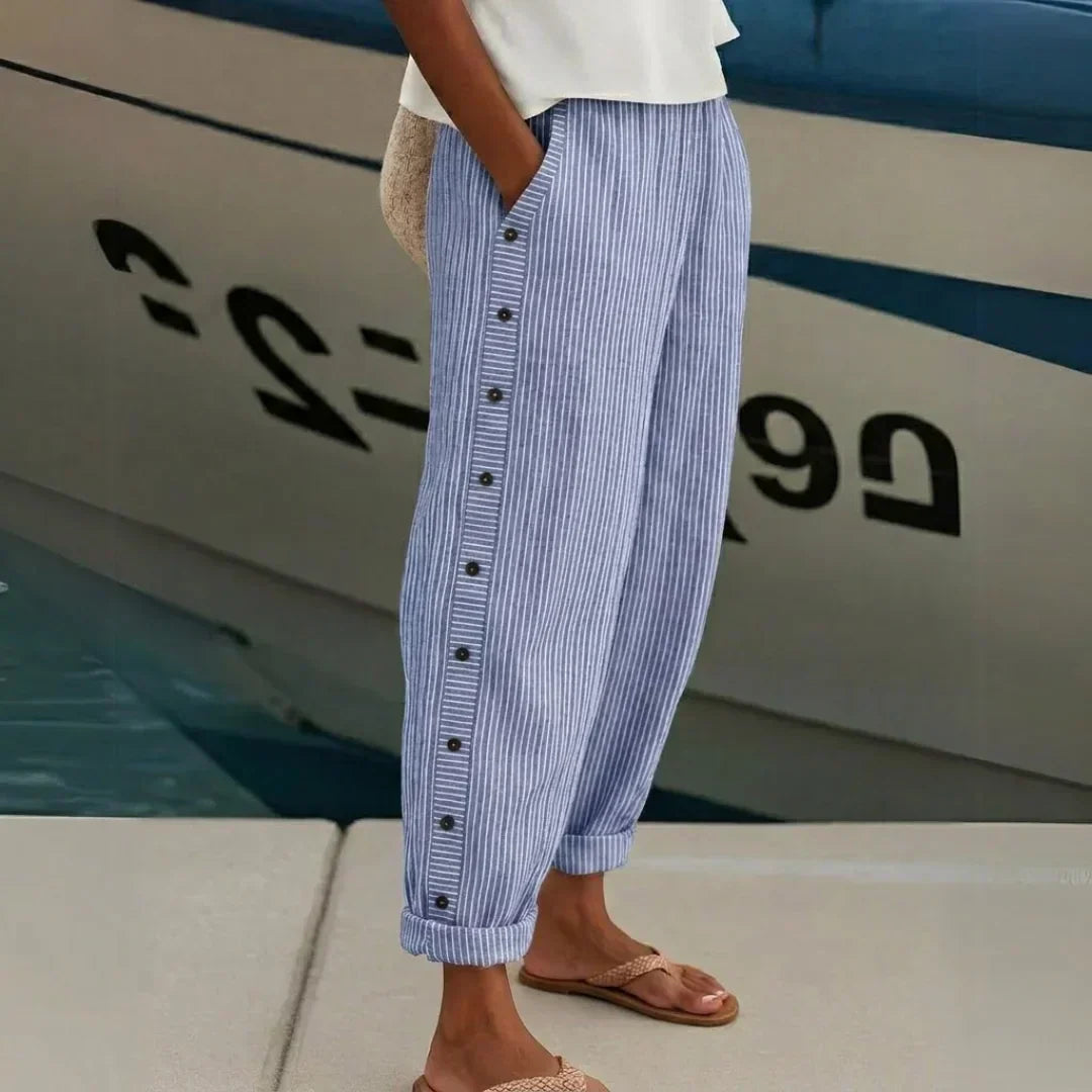 Woman wearing striped high-waisted button pants