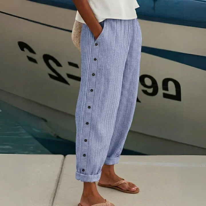 Woman wearing striped high-waisted button pants