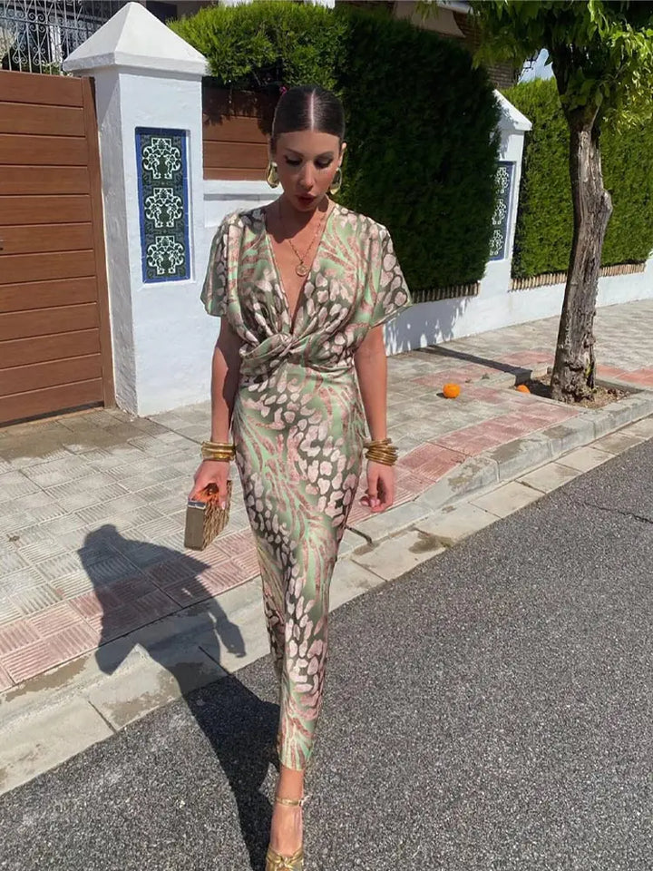 Woman wearing a V-neck maxi dress with wrap detail