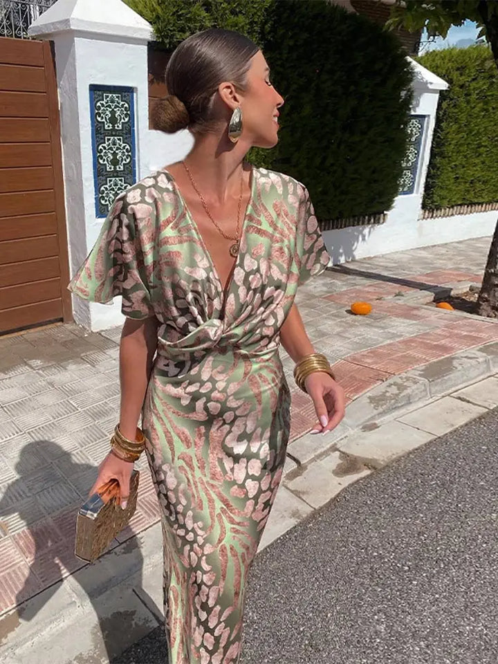 Woman wearing a V-neck maxi dress with wrap detail