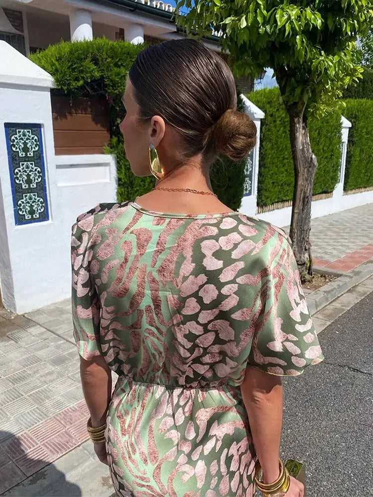 Woman wearing a V-neck maxi dress with wrap detail
