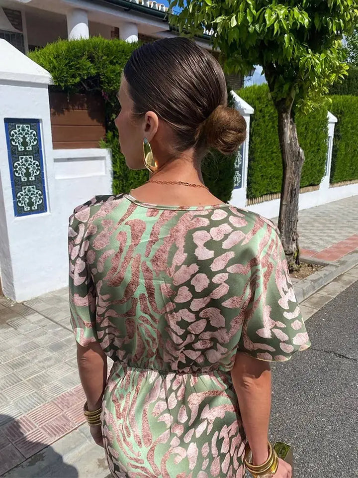 Woman wearing a V-neck maxi dress with wrap detail