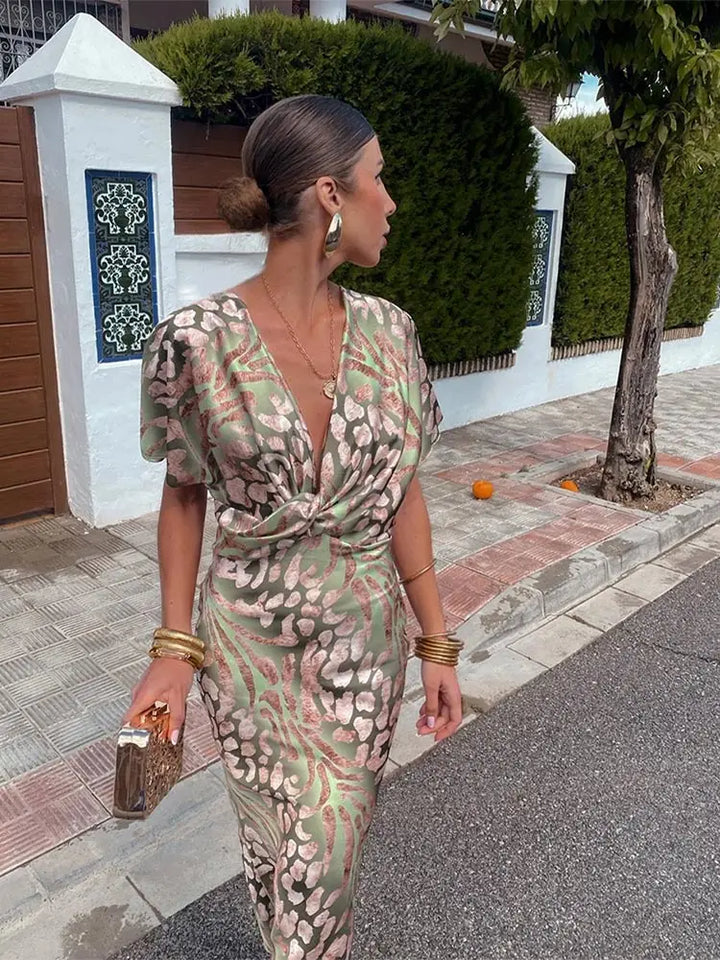 Woman wearing a V-neck maxi dress with wrap detail