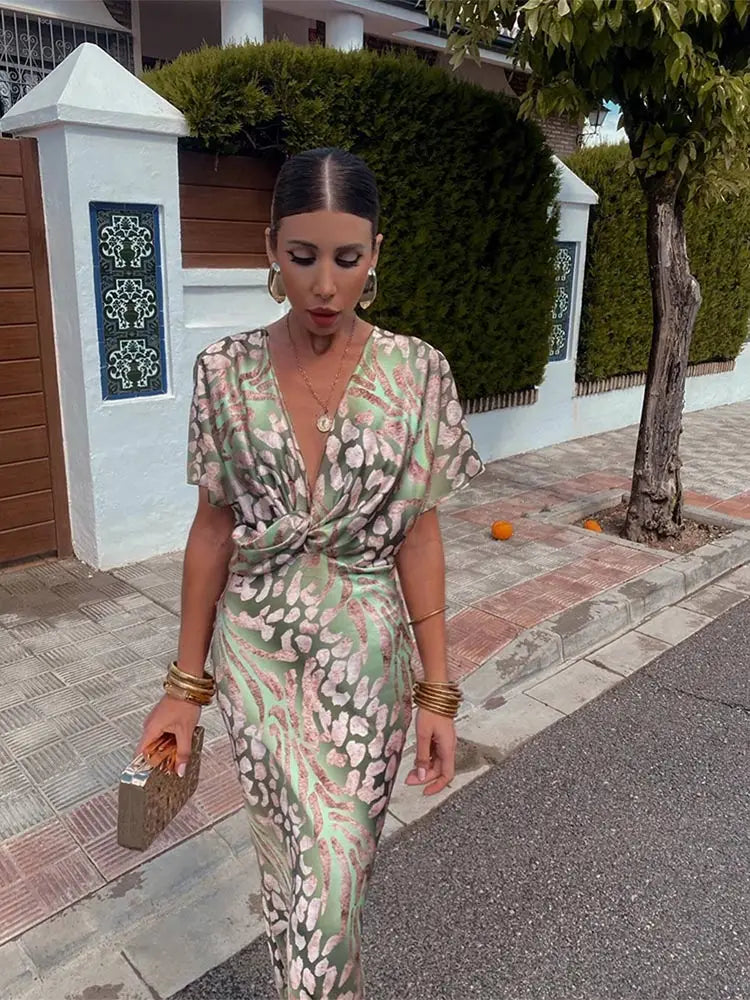 Woman wearing a V-neck maxi dress with wrap detail