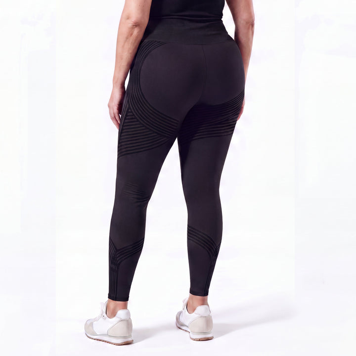 Woman wearing sculpting anti-cellulite leggings in black