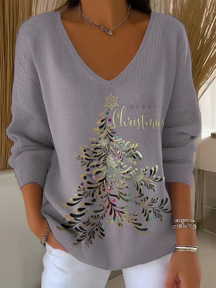 Woman wearing festive V-neck Christmas sweater with holiday print