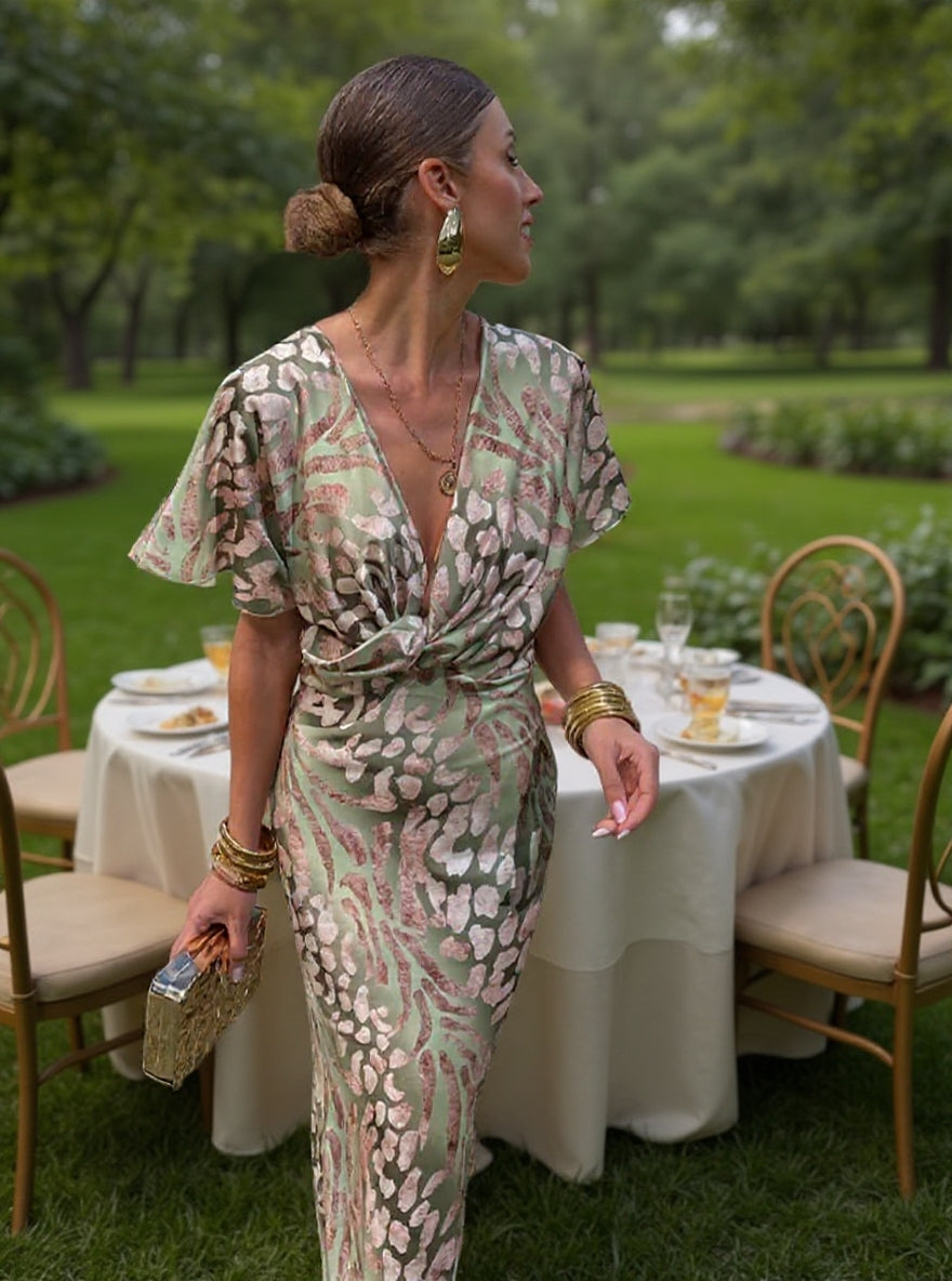 Woman wearing a V-neck maxi dress with wrap detail