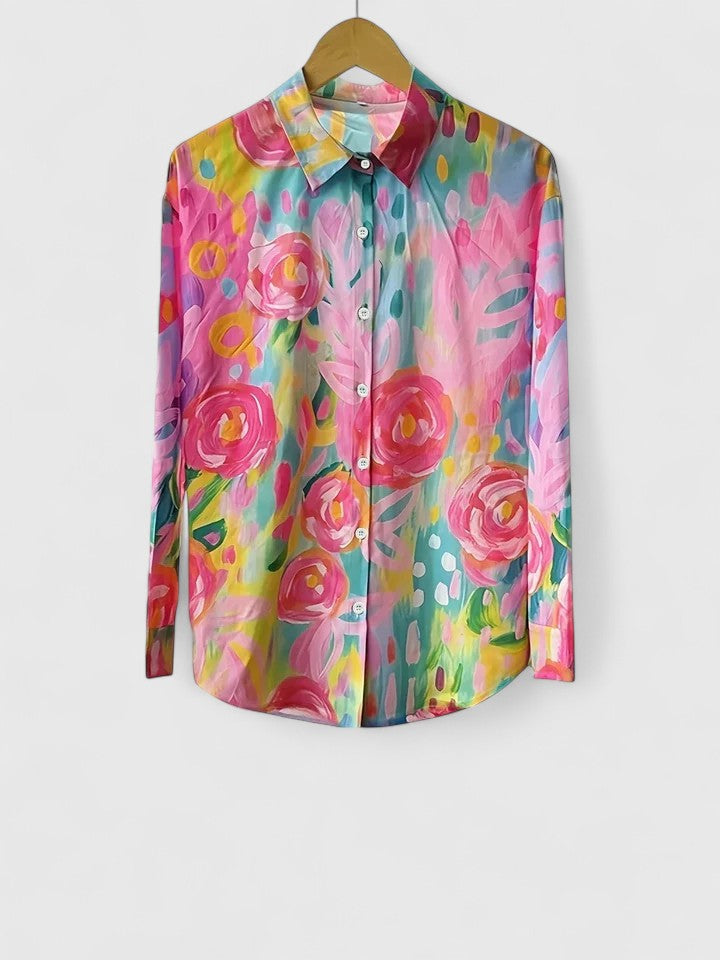 Woman wearing button-up blouse with artistic print