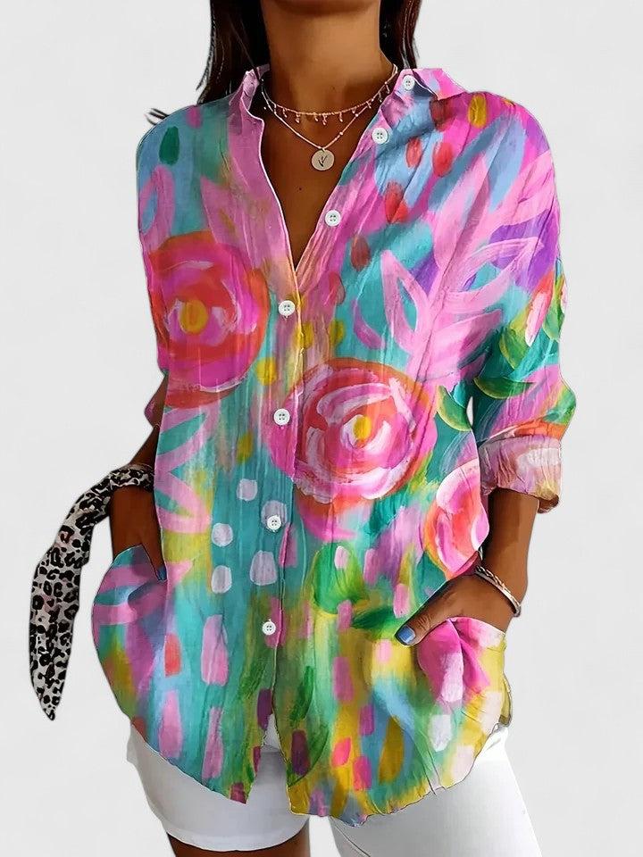Woman wearing button-up blouse with artistic print
