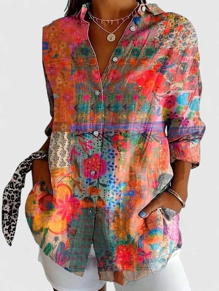 Woman wearing button-up blouse with artistic print