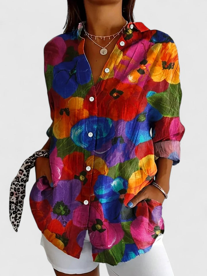 Woman wearing button-up blouse with artistic print