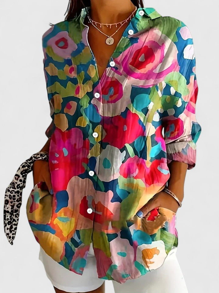 Woman wearing button-up blouse with artistic print