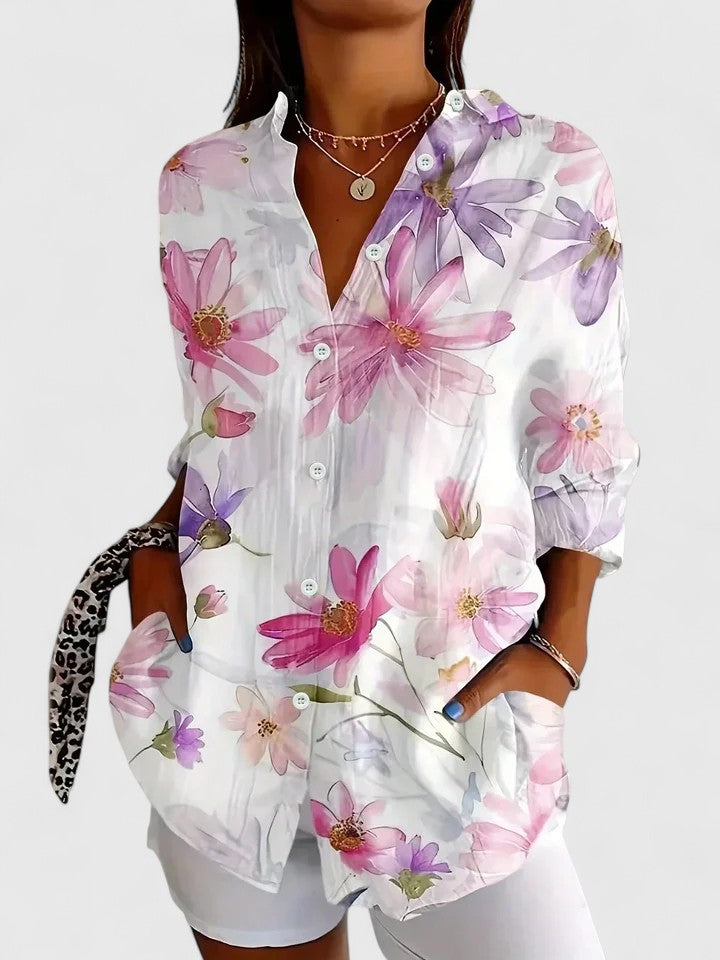Woman wearing button-up blouse with artistic print