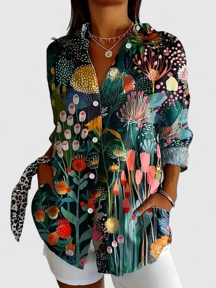 Woman wearing button-up blouse with artistic print