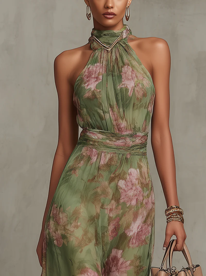 Woman wearing floral halter maxi dress with cinched waist