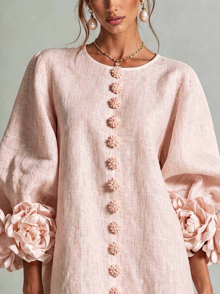 Woman wearing pink floral mini dress with rosette cuffs