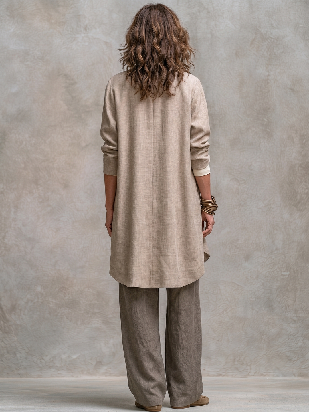 Woman wearing taupe wide leg three piece pant suit set