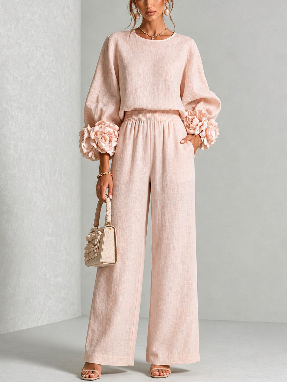 Woman wearing floral two-piece set with wide-leg pants
