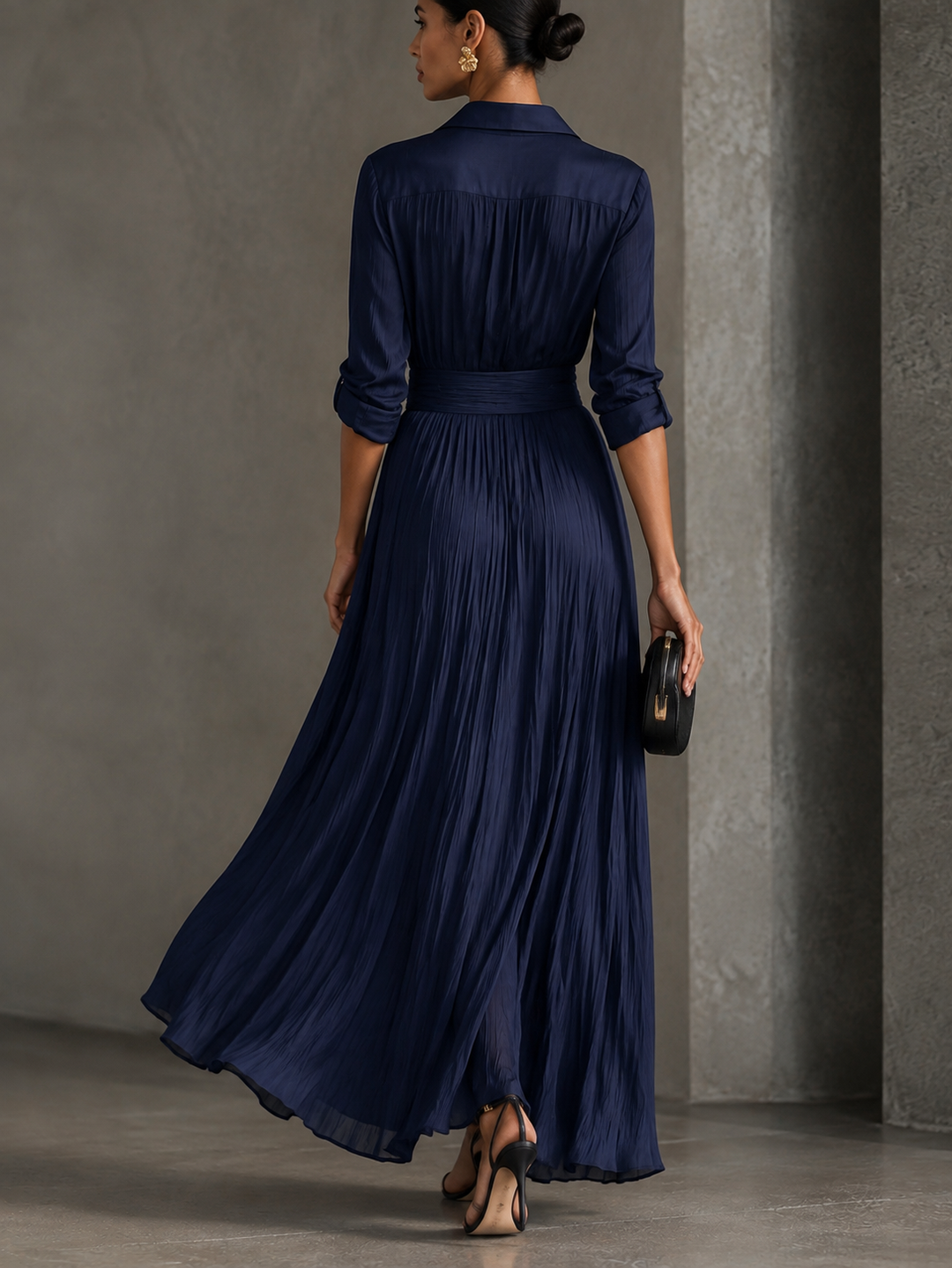 Woman wearing navy knotted V-neck maxi dress
