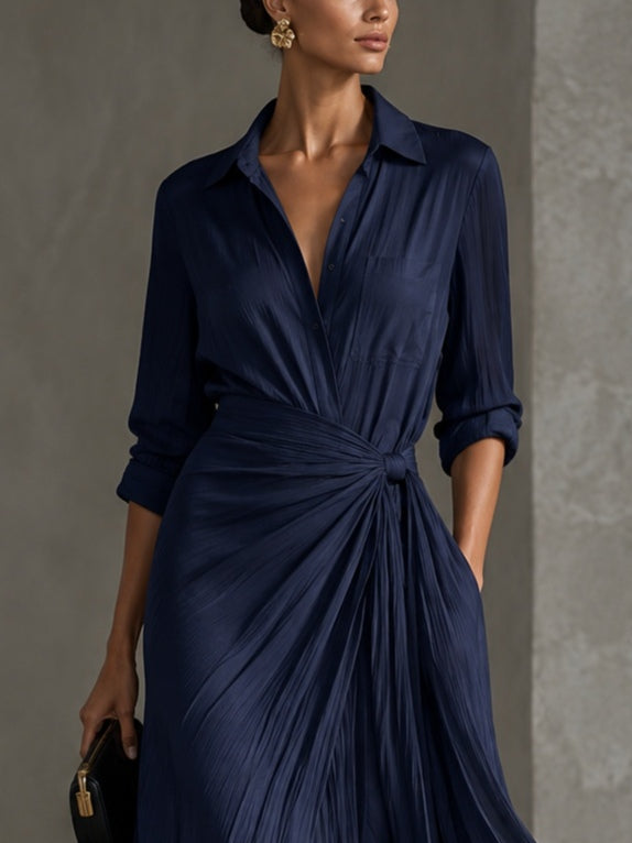 Woman wearing navy knotted V-neck maxi dress