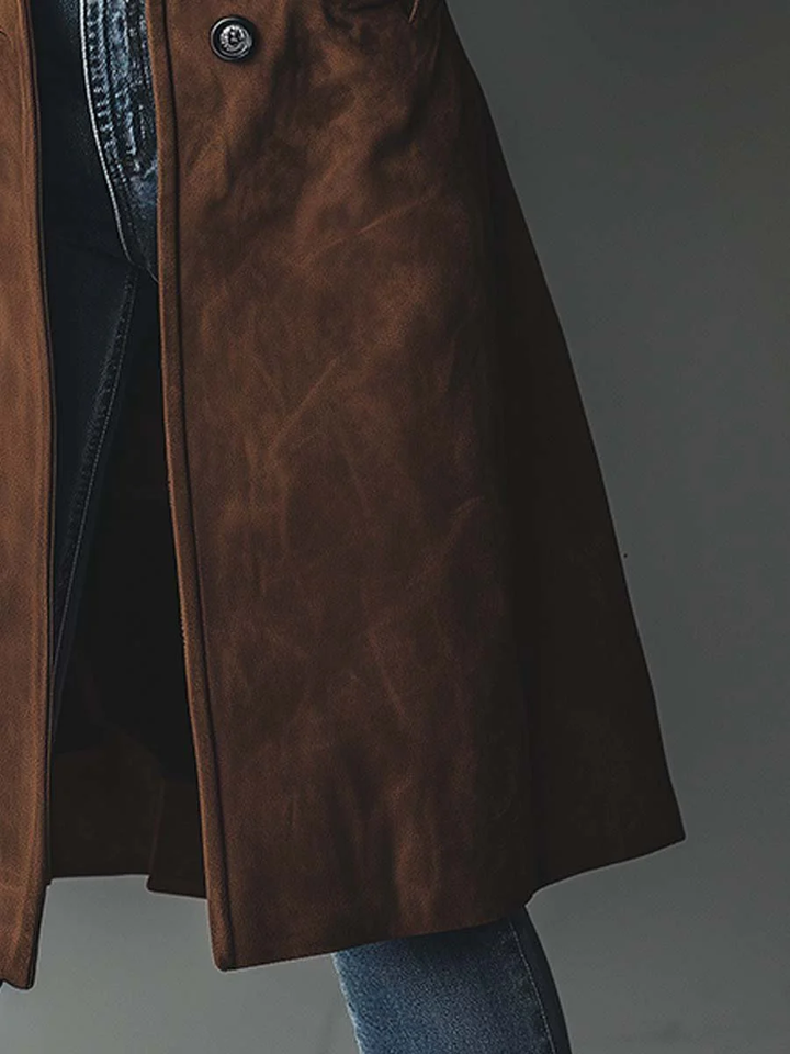Women's brown vintage-style trench coat worn over outfit