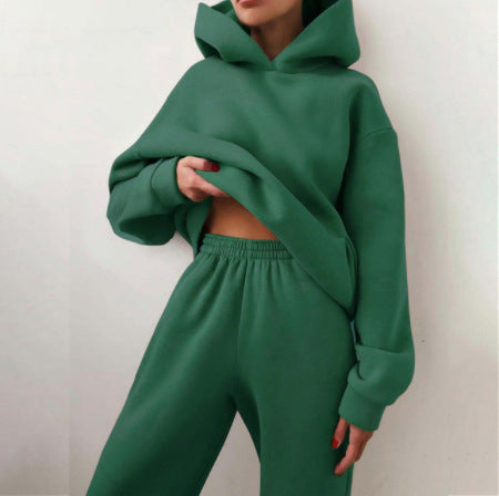 Woman wearing a hooded jogger set with elastic waist – dark green